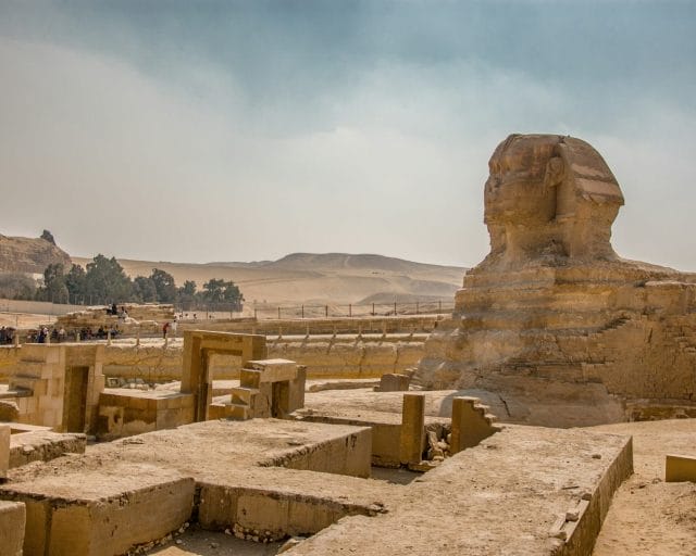 brown rock formation under white sky during daytime